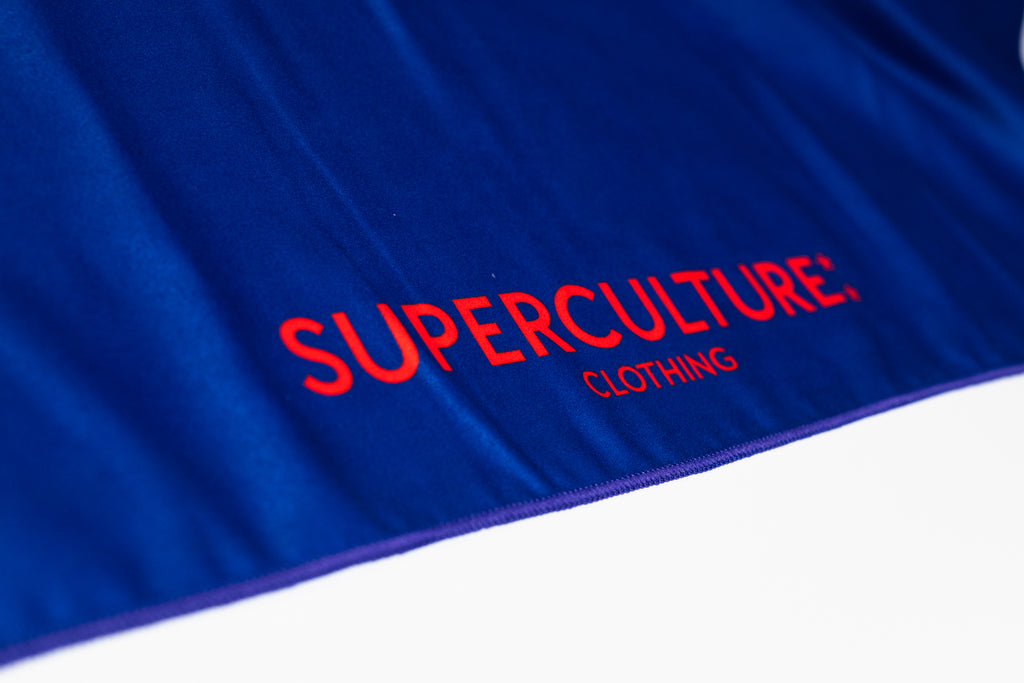 SUPERCULTURE Telo mare Viola in microfibra con stampa DAY OFF